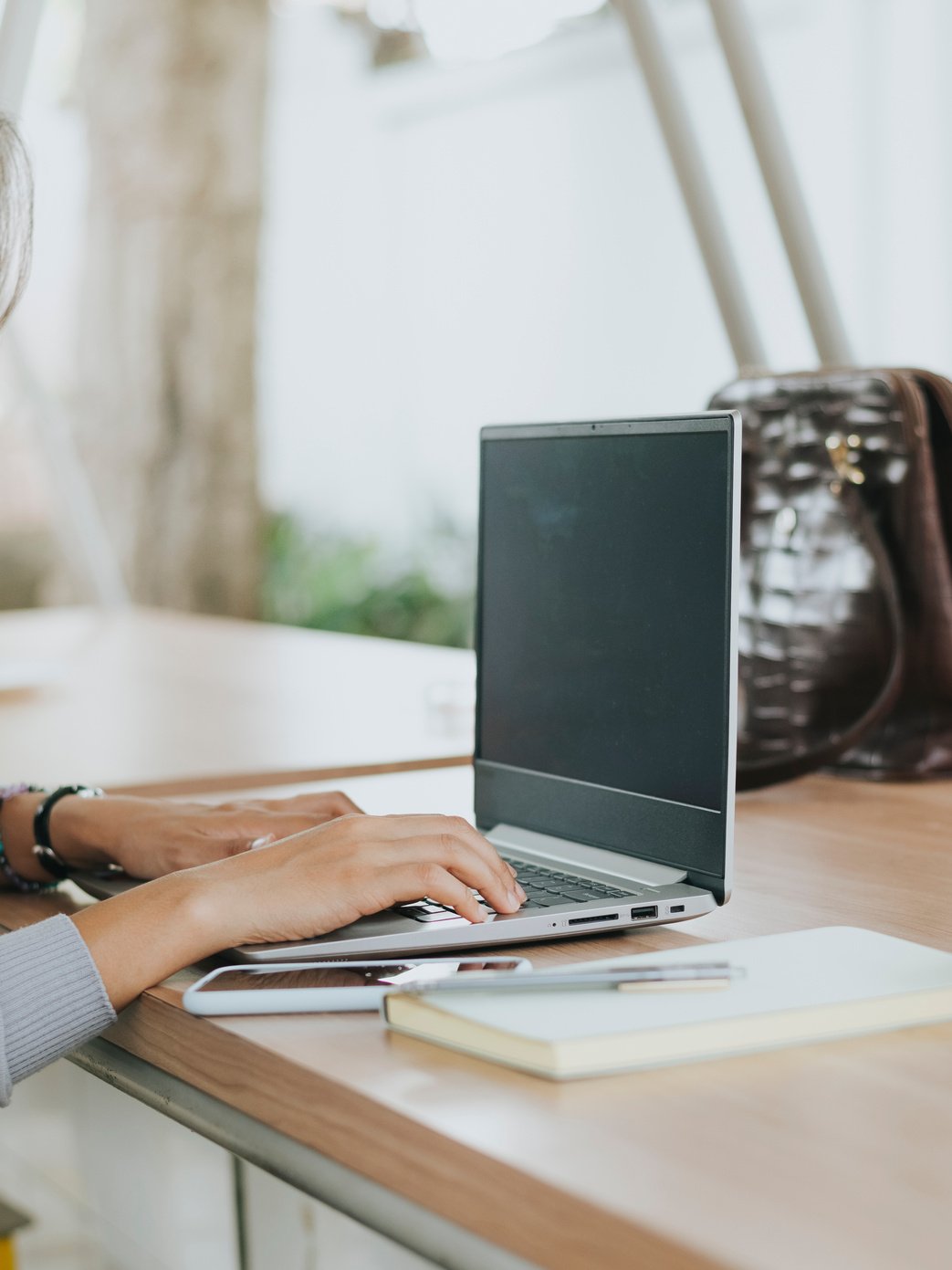 Woman Using Her Laptop Outdoors